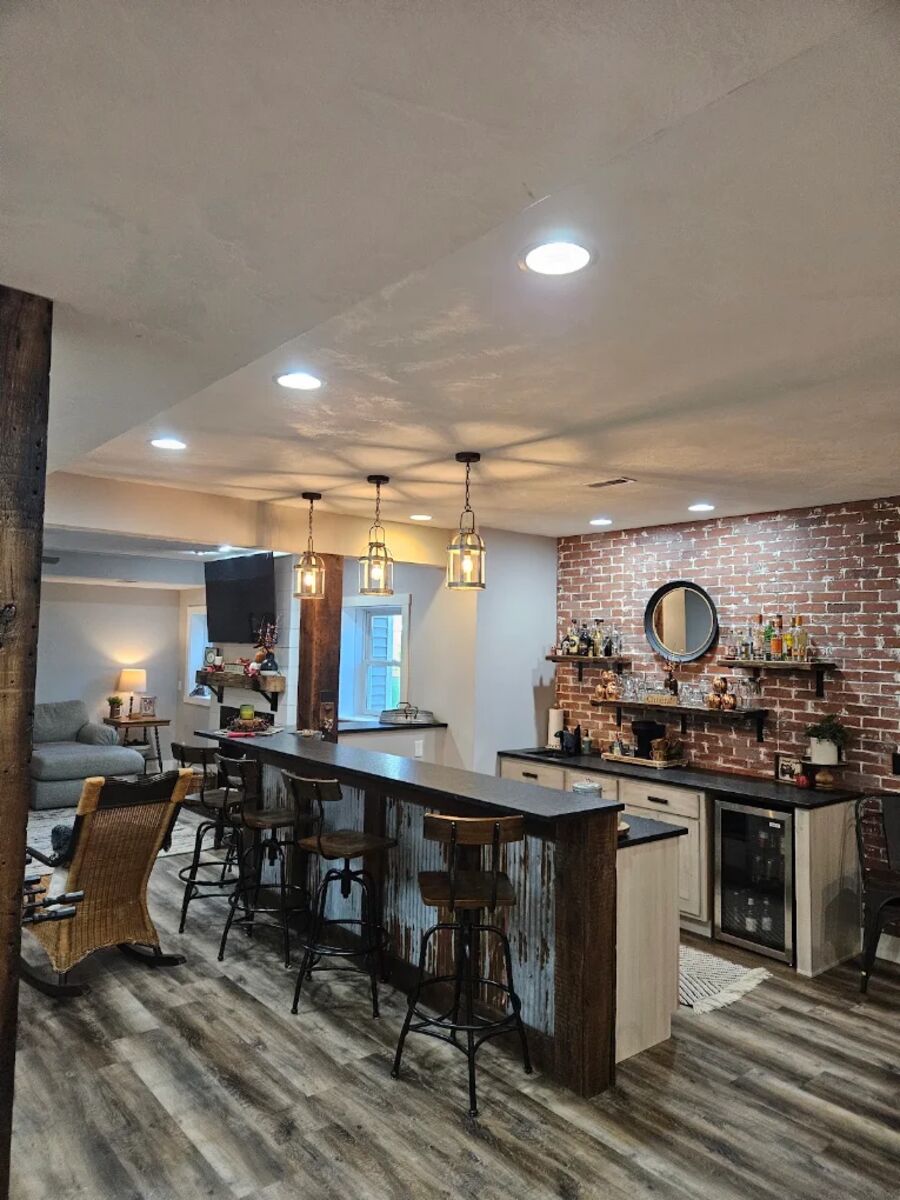 Finished basement bar with recessed and pendant lighting wired by RP Electric